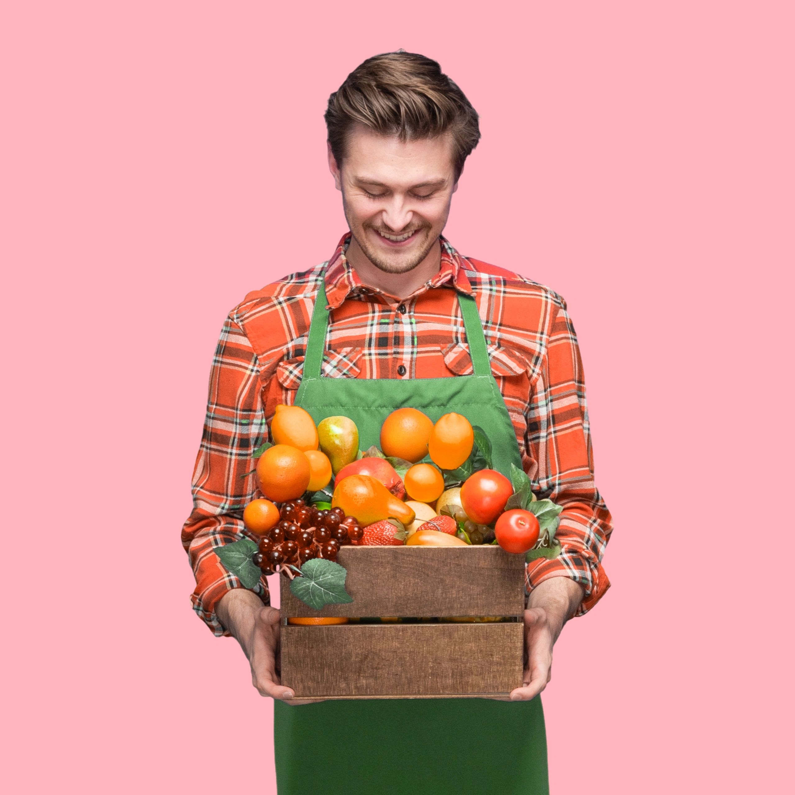 Team member holding a container and smiling