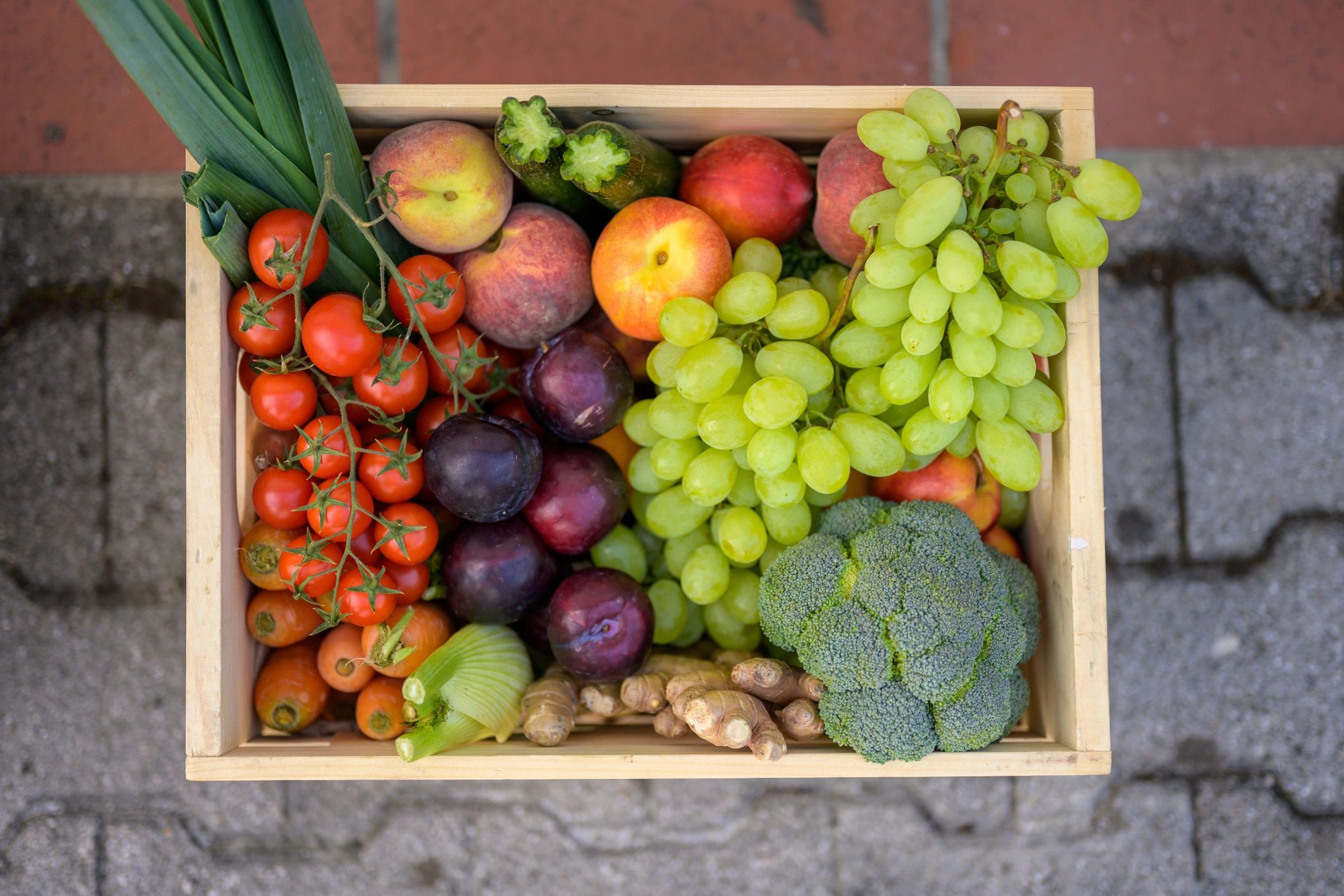 Fresh produce delivery crate at a front door