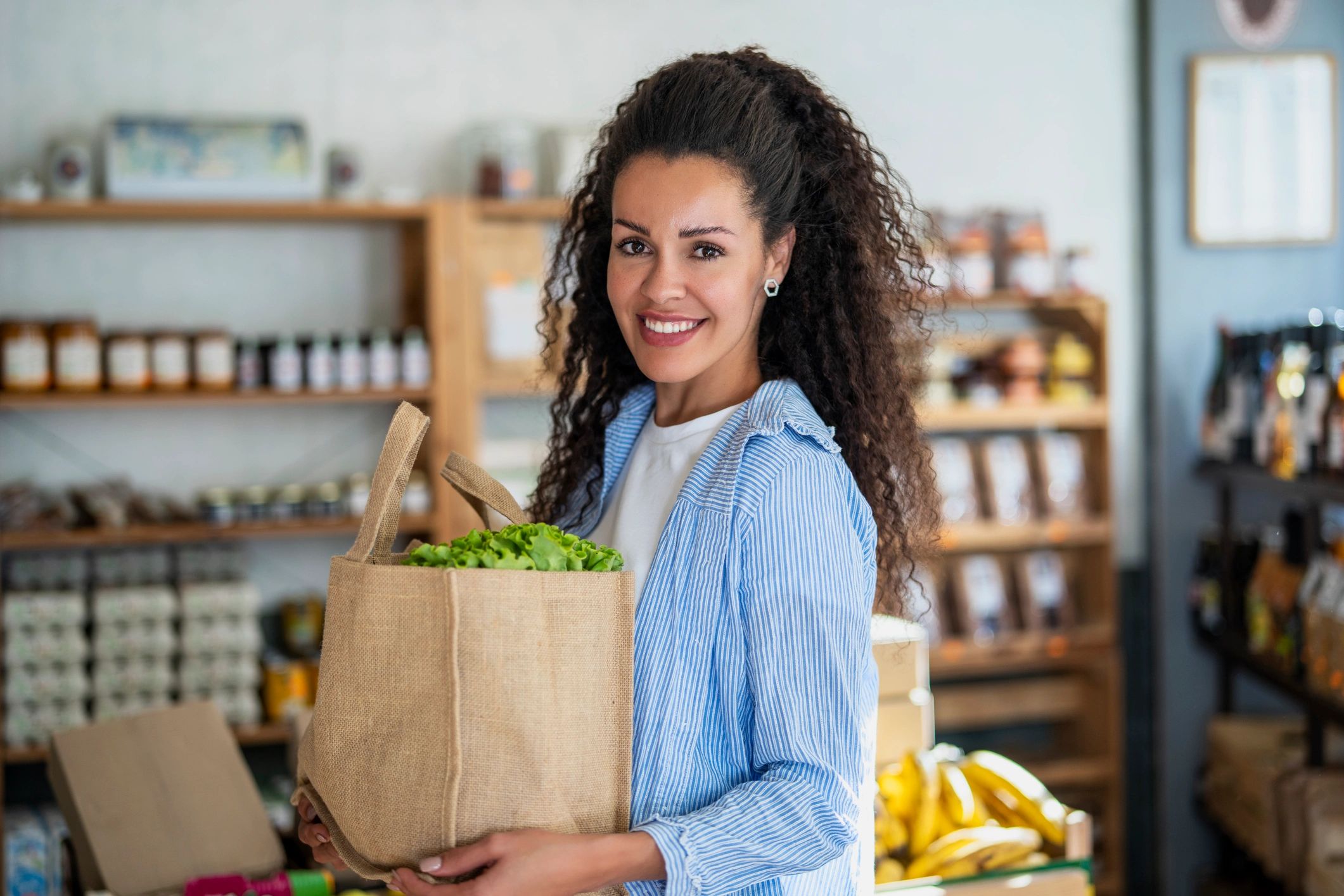 Team member smiling in a shop setting